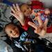 Four-year-old twin brothers Caine and Carter Flowers pose for a photo. The pair will celebrate their fourth birthday on Leap Day, February 29.  Melanie Maxwell I AnnArbor.com